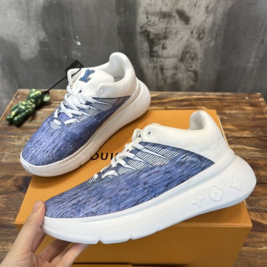 L Blue and White Trainers Pair Angle Angled view of a pair of L blue and white trainers showcasing lace-up design