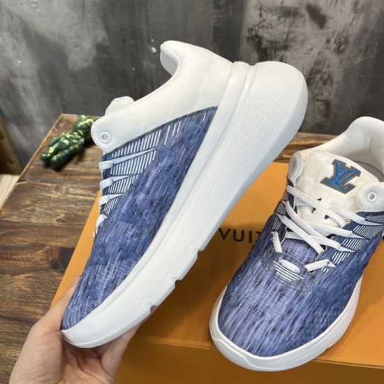 L Blue and White Trainers Side Detail Close up view of the blue and white patterned side panels and lacing system