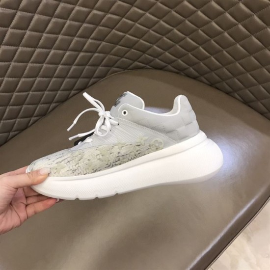 Outer Side View of L Show Up Monogram Pattern Chunky Sole Low Top Trainers in white and grey Outer side profile being held, showing the sculpted white sole of the white and grey L Show Up Monogram Pattern Chunky Sole Low Top Trainers