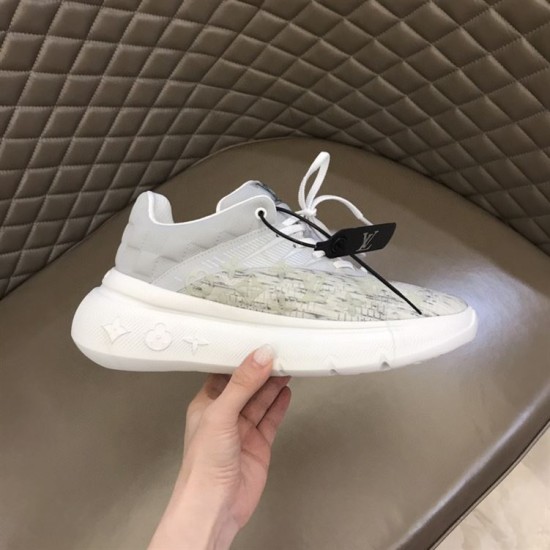 Lateral View of L Show Up Monogram Pattern Chunky Sole Low Top Trainers in white and grey Lateral side view being held, highlighting the chunky white sole and monogram pattern of the white and grey L Show Up Monogram Pattern Chunky Sole Low Top Trainers