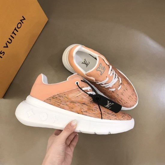 L Show Up Low Top Monogram Trainers Peach held showing outer sole details