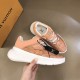 L Show Up Low Top Monogram Trainers Peach held showing outer sole details