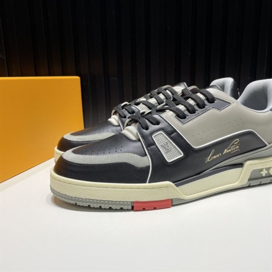 L Trainer Pair Front Side View in black and grey L Trainer low top black and grey leather trainers pair showcased from front side angle