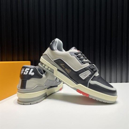 L Trainer Rear Heel Detail in black and grey L Trainer low top black and grey leather trainers showing rear heel detail and #54 branding