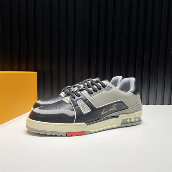 L Trainer Pair Front Diagonal View in black and grey L Trainer low top black and grey leather trainers pair displayed from front diagonal angle