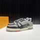 L Trainer Pair Front Diagonal View in black and grey L Trainer low top black and grey leather trainers pair displayed from front diagonal angle