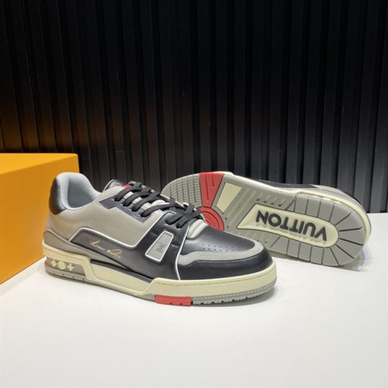L Trainer Angled Outsole View in black and grey L Trainer low top black and grey leather trainer angled view with outsole tread visible