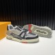 L Trainer Angled Outsole View in black and grey L Trainer low top black and grey leather trainer angled view with outsole tread visible