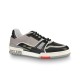 L Trainer Studio Outer Side Profile in black and grey L Trainer low top black and grey leather trainer studio shot from outer side profile