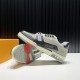 L Trainer Outsole View in black and grey L Trainer low top black and grey leather trainer positioned beside outsole view