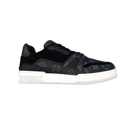 Studio Side View - L Trainer Monogram Canvas Low Top Black Trainers in black and white Studio side profile of L Trainer Monogram Canvas Low Top Black Trainers on plain background in black and white