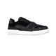 Studio Side View - L Trainer Monogram Canvas Low Top Black Trainers in black and white Studio side profile of L Trainer Monogram Canvas Low Top Black Trainers on plain background in black and white