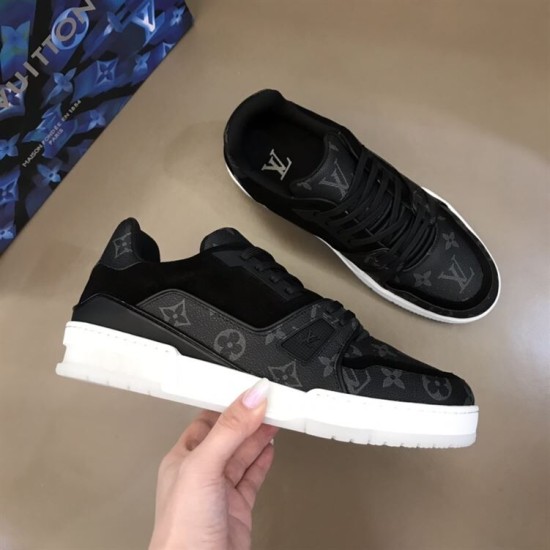Overhead Angle - L Trainer Monogram Canvas Low Top Black Trainers in black and white Top-down angled view of L Trainer Monogram Canvas Low Top Black Trainers held in hand in black and white