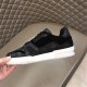 Lateral Side - L Trainer Monogram Canvas Low Top Black Trainers in black and white Lateral side view highlighting the black upper panels and white sole of L Trainer Monogram Canvas Low Top Black Trainers