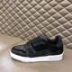 Medial View - L Trainer Monogram Canvas Low Top Black Trainers in black and white Medial side profile showing toe perforations and contrasting textures on L Trainer Monogram Canvas Low Top Black Trainers in black and white