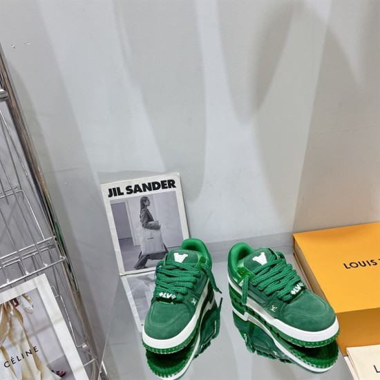 Green L Suede Platform Sneakers Overhead Pair in green and white Overhead view of two green L suede platform sneakers on a reflective table in green and white