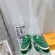 Green L Suede Platform Sneakers Overhead Pair in green and white Overhead view of two green L suede platform sneakers on a reflective table in green and white