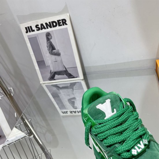 Green L Suede Platform Sneakers Tongue Detail in green and white Macro shot of the padded tongue and logo on green L platform sneakers in green and white