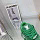 Green L Suede Platform Sneakers Tongue Detail in green and white Macro shot of the padded tongue and logo on green L platform sneakers in green and white