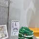 Green L Suede Platform Trainers Display Pair in green and white Pair of green L suede platform trainers displayed on a reflective surface next to brand boxes in green and white