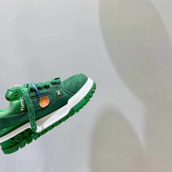 Green L Suede Platform Sneakers Side Close-Up in green and white Close-up of the side panel and thick white sole on green L platform sneakers