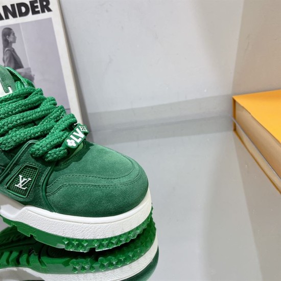 Green L Suede Platform Sneakers Detail Shot in green and white Close-up of the green suede upper and lace charm on L platform sneakers in green and white