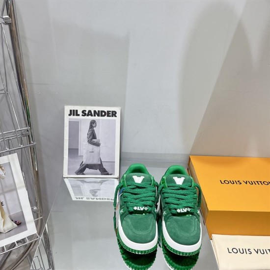 Green L Suede Platform Sneakers Front View in green and white Front view of green L suede platform sneakers showing thick laces and toe box details in green and white