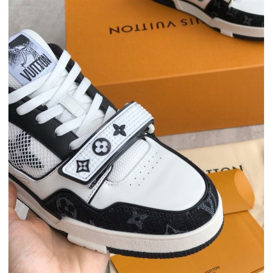 Strap and lacing detail of L Monogram Denim Strap Trainers in denim and black Close up of the strap and lacing on L Monogram Denim Strap Trainers in denim and black