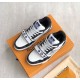 Angled top view of L Monogram Denim Strap Trainers in denim and black Angled top view of L Monogram Denim Strap Trainers in black and white