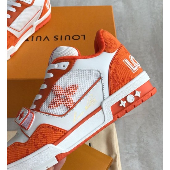 Lateral Side View of Orange L Trainer Monogram Denim Low Top Trainers in orange and white Outer side panel of orange and white L trainers showing monogram denim and heel branding