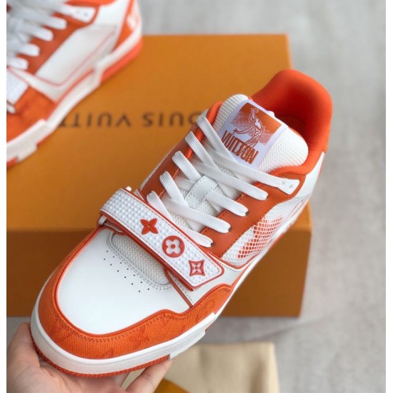 Front Angled View of Orange L Trainer Monogram Denim Low Top Trainers in orange and white Angled view focusing on laces and branded tongue of orange and white L trainers