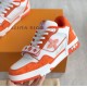 Three Quarter View of Orange L Trainer Monogram Denim Low Top Trainers in orange and white Three quarter angle of orange and white L trainers displaying side script logo