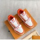 Overhead View of Orange L Trainer Monogram Denim Low Top Trainers in orange and white Overhead perspective of two orange and white L trainers highlighting upper patterns
