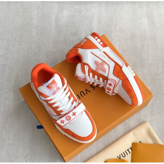 Pair View of Orange L Trainer Monogram Denim Low Top Trainers in orange and white Pair of orange and white L trainers displayed together on orange packaging