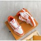Pair View of Orange L Trainer Monogram Denim Low Top Trainers in orange and white Pair of orange and white L trainers displayed together on orange packaging