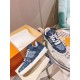 L Monogram Blue Denim Low Top Trainer Sneakers arranged with packaging box