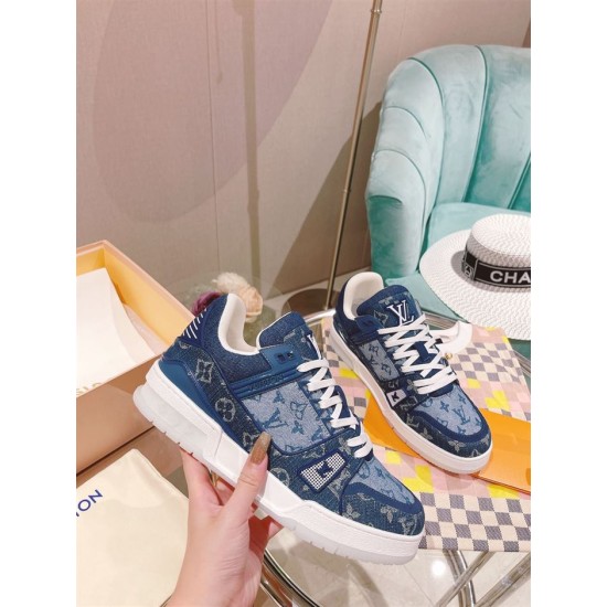 L Monogram Blue Denim Low Top Trainer Sneakers held in hand showing side panel