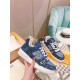 L Monogram Blue Denim Low Top Trainer Sneakers held in hand showing side panel