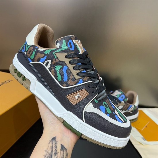 Hand-held angle of L Trainer Sneaker in multicolour and brown Close-up hand-held angle of L Trainer Sneaker illustrating textured brown leather upper and white midsole in multicolour and brown