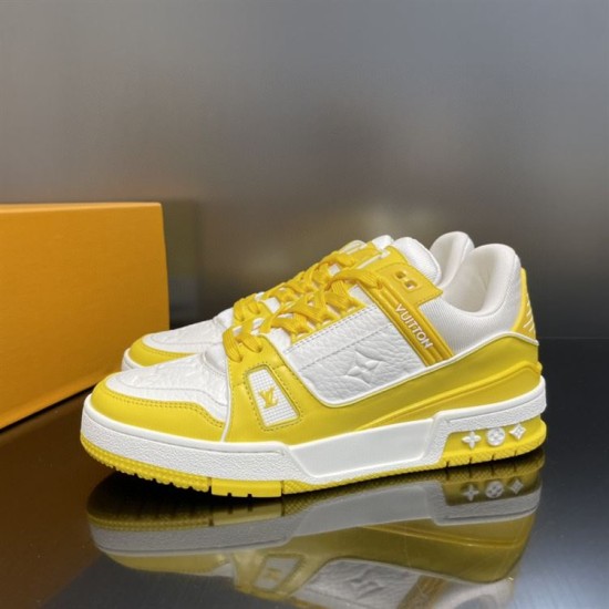 Side Profile Shot - L Trainer Low Top Yellow And White Leather Trainers Side profile shot highlighting the contrasting midsole and side branding in yellow and white
