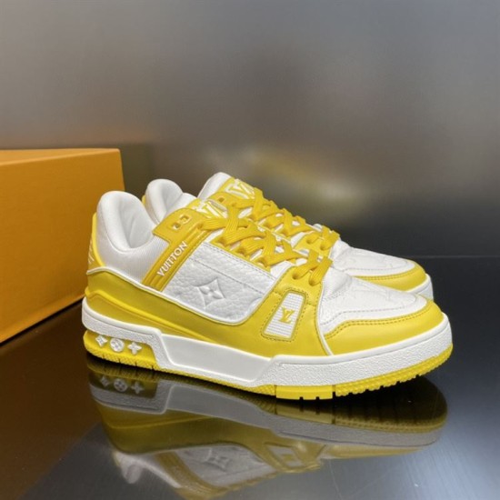 Diagonal Pairing View - L Trainer Low Top Yellow And White Leather Trainers Diagonal pairing view highlighting the vibrant yellow and white colourway