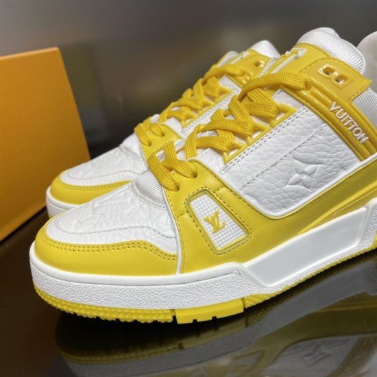 Lace Detail View - L Trainer Low Top Yellow And White Leather Trainers Close-up of the front lace system and textured upper of L Trainer Low Top Yellow And White Leather Trainers