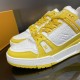 Lace Detail View - L Trainer Low Top Yellow And White Leather Trainers Close-up of the front lace system and textured upper of L Trainer Low Top Yellow And White Leather Trainers