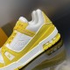 Branded Side Panel Detail - L Trainer Low Top Yellow And White Leather Trainers Close-up view of the branded side panel and midsole detailing in yellow and white