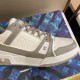 L Grey Sneaker - Side Panel Detail in grey and white Detailed close-up of side panel stitching and branding on L grey sneaker in grey and white