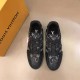 Top-down view of L black monogram leather trainer low top shoes showing laces in black and red