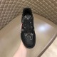 Front upper view of L black monogram leather trainer low top shoes in black and red