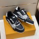Angled pair arrangement of L trainer low top leather sneakers in black and grey