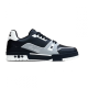 Studio side profile of L trainer low top leather sneakers against a plain background in black and grey