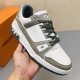 L Trainer Sneaker Low Top White Grey Monogram Leather Handheld View L Trainer Sneaker Low Top White Grey Monogram Leather held in hand view
